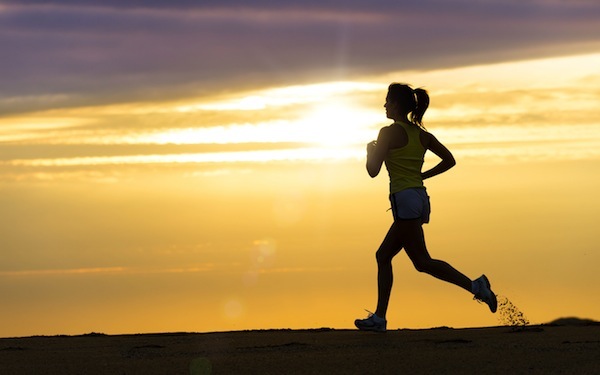Athlete Running At Sunset On Beach